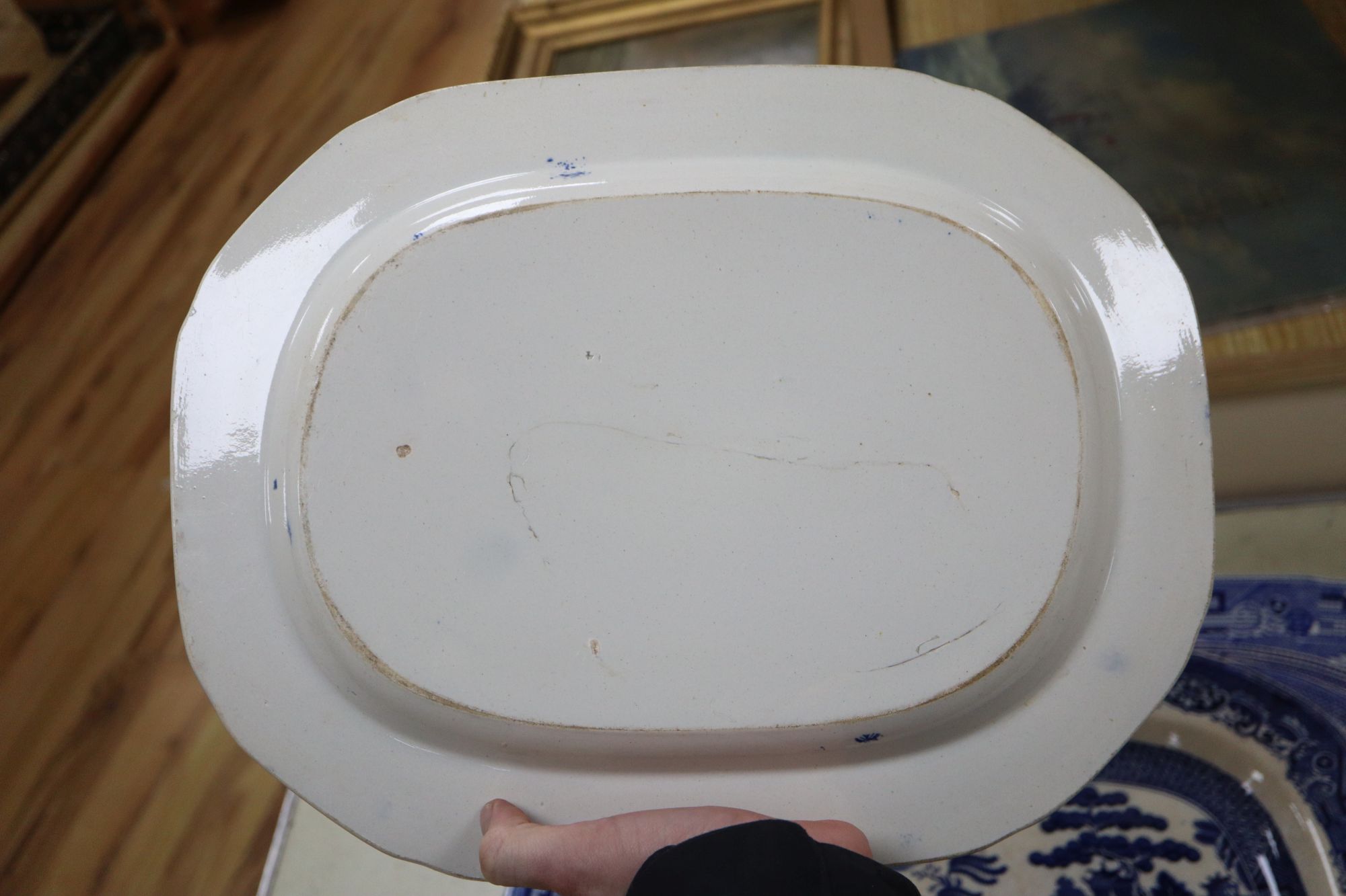 A 19th century transfer-printed large blue and white platter and seven similar smaller platters